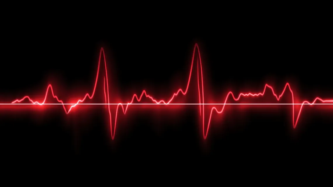 Neon red heartbeat line glowing on a black background.