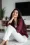 Asian woman sitting on the ground.